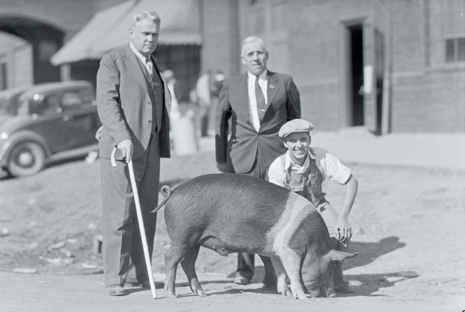 Kingan buyer L.M. Maroney with John Hardin and his Grand Champion Barrow at the 1935 Indiana State Fair.