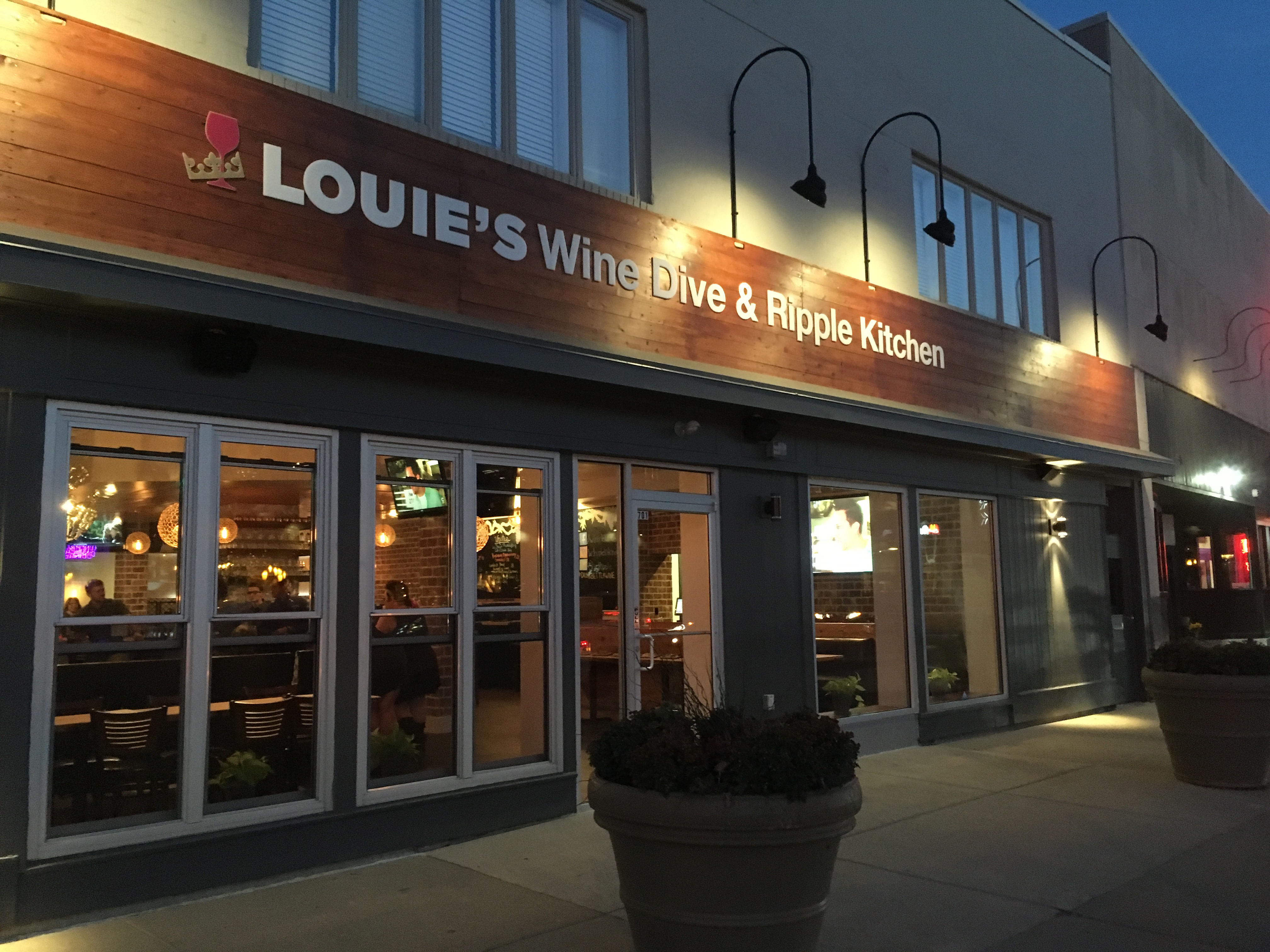 The exterior of Louie's Wine Dive & Ripple Kitchen on the corner of College and Broad Ripple Avenue.