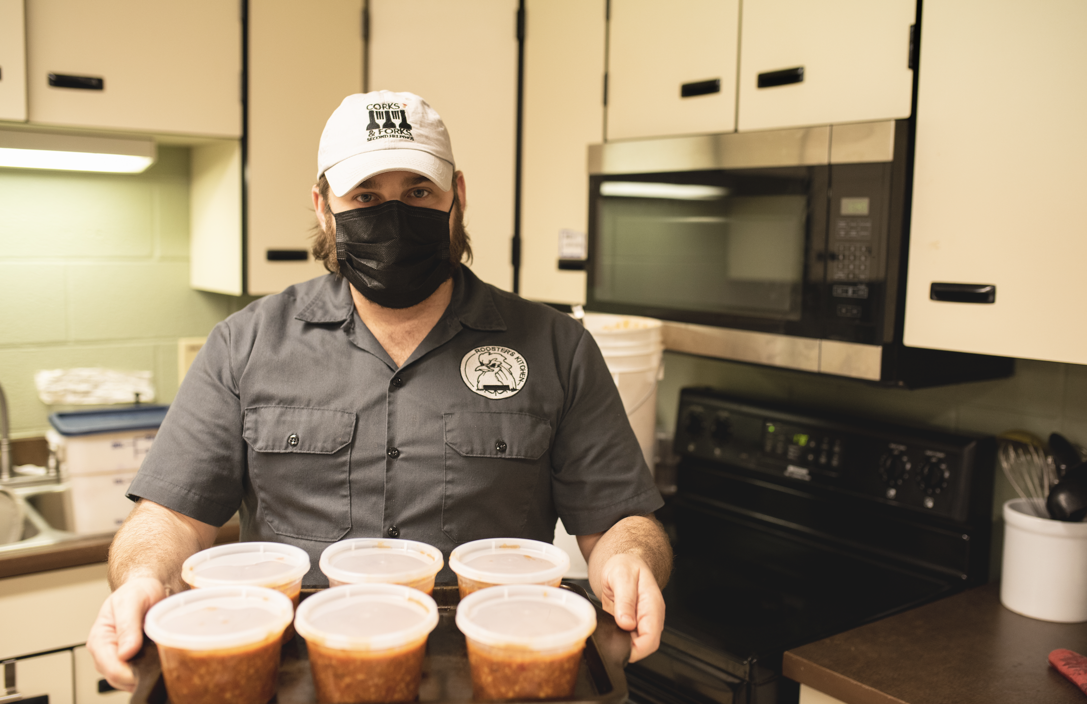 Ross Katz serves chili at No Questions asked Food Pantry