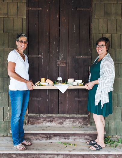 Left to right: Lesile Jacobs of Jacobs & Brichford and Laura Davenport, co-owner of Tulip Tree Creamery. Not pictured: Judy Schad of Capriole Farm. Photo location: Traders Point Creamery