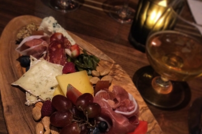A board of local cheeses, meats, pickled vegetables and more