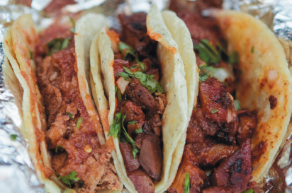 A three-taco combination of pork, chicken and steak from West Coast Tacos