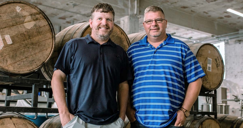 [Photo by Sarah Belle Photography] Brothers Jerrad (left) and Jason (right) Oakley opened a tasting room for their Oakley Brothers’ Distillery in 2017