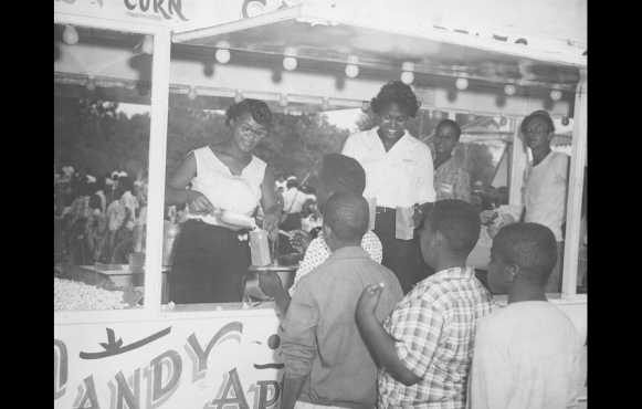 Children in line for popcorn at the Recorder Picnic.  Photo credit the Indianapolis Recorder Collection, The Indiana Historical Society.